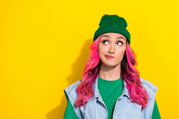 Photo of pretty girlish interested girl with pink hairdo dressed denim waistcoat look empty space...