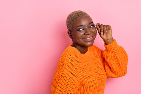 Photo of cheerful charming lady arm touch glasses look interested empty space ad isolated on pink color background