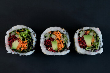 Vegan, Vegetarian sushi roll, Healthy Japanese food on black background.