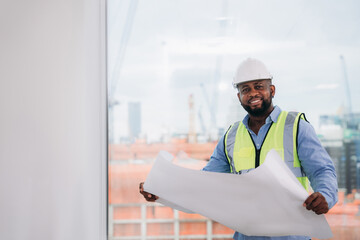 Portrait of Engineers looking camera and people concluding their meeting architectural project as a team.