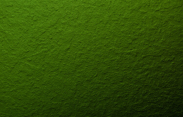 Green background from decorative plaster with abstract spots. Unusual green wall texture with beautiful patterns, creative surface background. Front covering for facing of buildings.