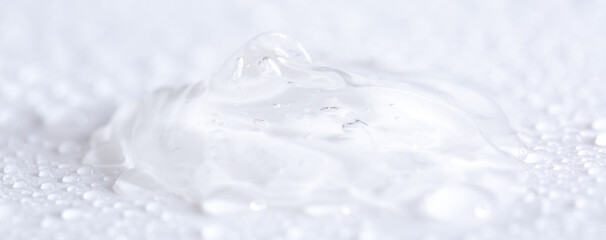 Obraz na płótnie Canvas Hyaluronic acid or collagen gel close up. Textured background with oxygen bubbles in cosmetics. Moisturizing serum for the skin.