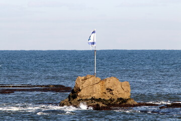The blue and white flag of Israel with the six-pointed Star of David.