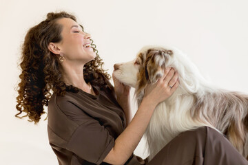 young Woman and Australian Shepherd Dog