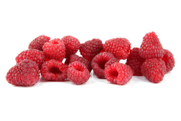 Pile of raspberries isolated on white background. Ripe fresh red berries.