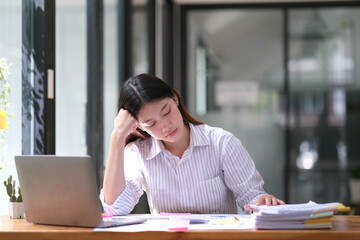 Stress Asian woman business people and work concept, a tired Asian businessman in workplace office desk.