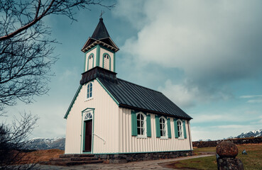 Fototapeta na wymiar Nice church with black roof and white walls in Iceland