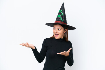 Young caucasian woman costume as witch isolated on white background with surprise facial expression