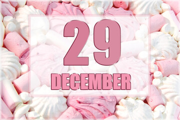 calendar date on the background of white and pink marshmallows. December 29 is the twenty-ninth day of the month