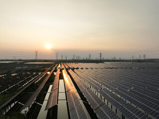 Fototapeta na wymiar solar power station in farm during sunset