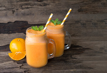 Orange smoothies yellow colorful fruit juice milkshake blend beverage healthy high protein the taste yummy In glass,drink to lose weight drink episode morning isolated on white background.