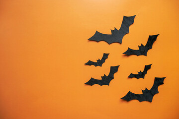 A collage layout for the Halloween holiday. Applications, carving figures in the shape of black bats. View from above