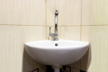 faucet and sink, close-up concept of saving water, paying utility bills