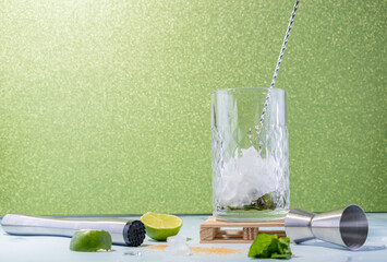 low mojito with a green background with crushed ice