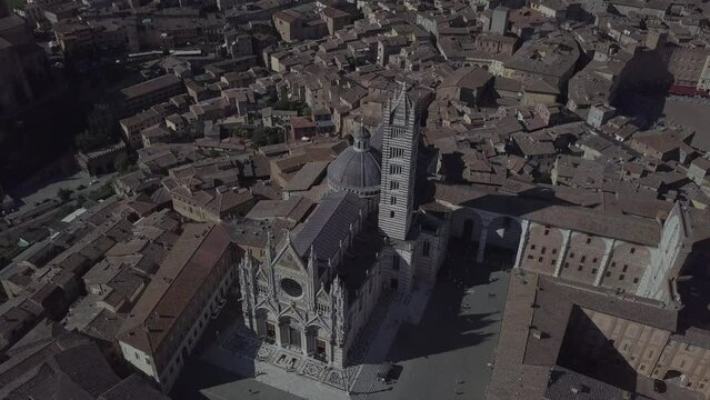 Siena Italy Cathedral Duomo in Tuscany, Drone Aerial footage during golden hour