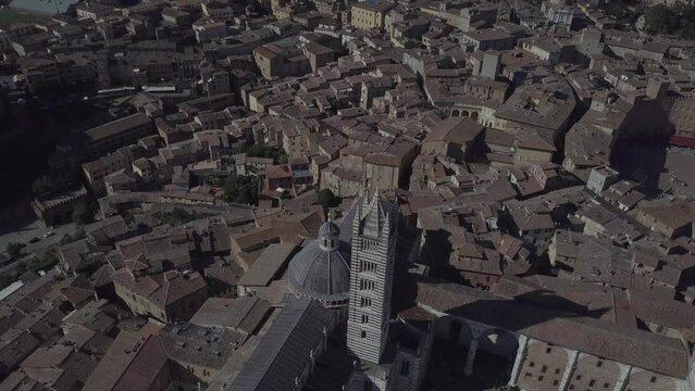 Siena Italy Cathedral Duomo in Tuscany, Drone Aerial footage during golden hour
