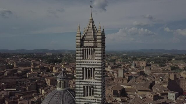 Siena Italy Cathedral Duomo in Tuscany, Drone Aerial footage during golden hour
