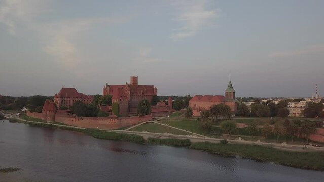 Malbork Castle and Nogat River in Poland Golden hour aerial drone footage