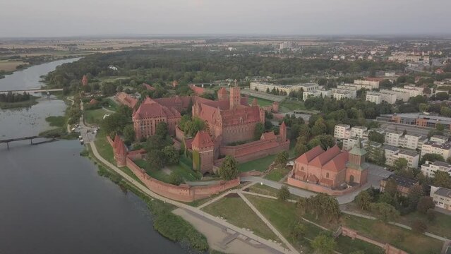 Malbork Castle and Nogat River in Poland Golden hour aerial drone footage