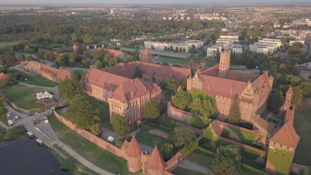 Malbork Castle and Nogat River in Poland Golden hour aerial drone footage