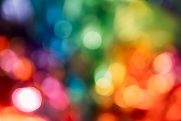 Blurred bokeh background for Christmas and New Year holiday. Abstract colorful wallpaper with...