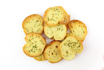 Pile of spiced bruschette chips isolated on white background
