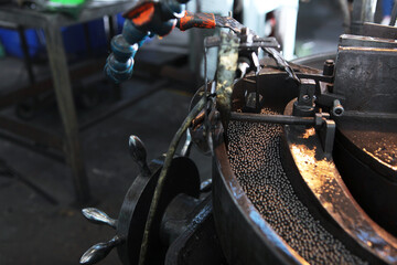 Fototapeta premium Old equipment for the production of bearings. Small diameter bearings.Industrial industry.Heavy industry. A photo in a real factory.