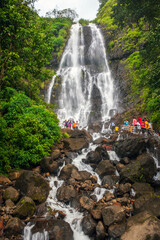 AMBOLI, September 2021: Tourists enjoy Amboli water falls at Amboli Ghat which is on the boarder of Goa and Maharashtra boarder, India.