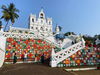 PANAJI, December 2021: Tourists enjoying fine evening in front of Immaculate Conception Church in Panaji City Goa, India. 
