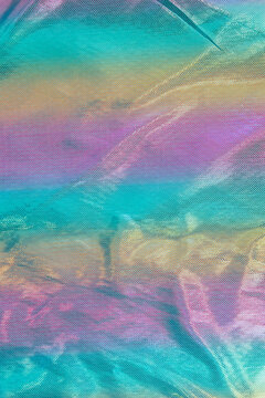 Blurred rainbow light refraction texture overlay effect for photo and mockups. holographic flare,holographic style texture background reflective fabric