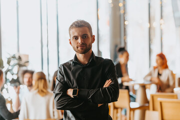 Cheerful self confident professional businessman with crossed hands portrait.