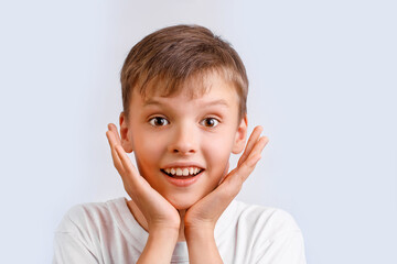 Portrait of wondered and excited and shoсked boy 