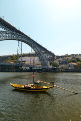 Traditional rabelo boat in the river Douro in Porto, Portugal, vertical image