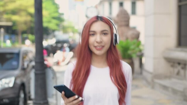 Holiday concept of 4k Resolution. Asian woman walking in the city. teenage girl fashion.