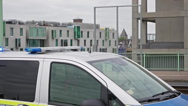 Police vehicle in Cologne, Germany with blue flashers in city at Severin bridge. Used by police to patrol streets, public places, as well as promptly respond to incidents