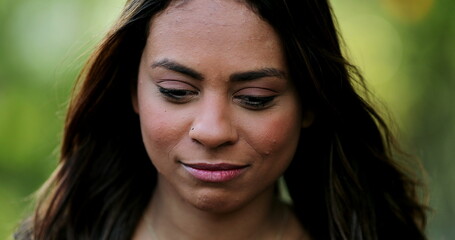 Pensive thoughtful hispanic woman feeling confused and in doubt