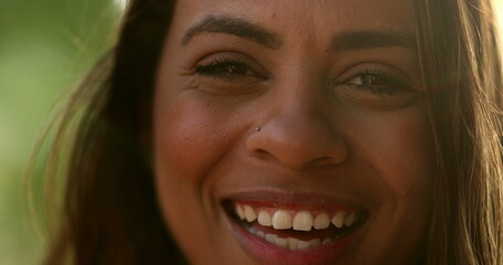 Latina black girl smiling portrait in sunlight outside