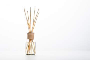 Aroma sticks wooden in a glass jar with aroma on a white background