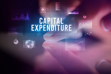 Finger touching tablet with business graphs and icons concept