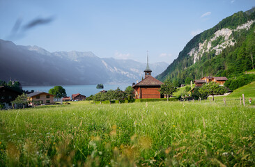 Beautiful swiss landscape. Cathedral in Iseltwald village on Brienzersee lake.