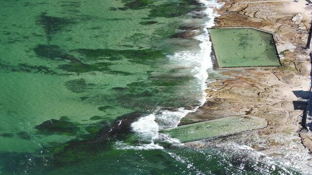 Aerial view of sea breaking sandy Cronulla beach