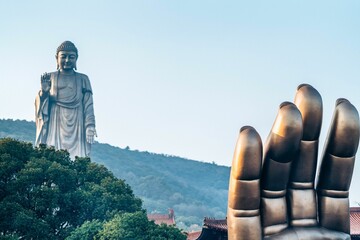 Grand Buddha at Ling Shan statue on blue sky background in Wuxi, Jiangsu, China