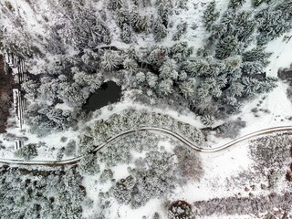 Aerial of Tara mountain and Lipovica lake in winter in Serbia. - obrazy, fototapety, plakaty