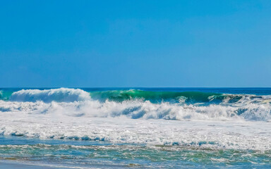 Naklejka na ściany i meble Extremely huge big surfer waves at beach Puerto Escondido Mexico.