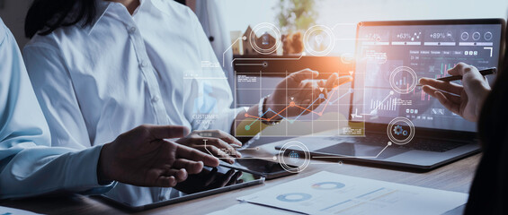 Technology and financial advisory services concepts. Business teamwork and working on digital laptop computer with advisor showing plan of investment to clients at table office. Digital marketing.