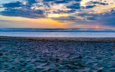 Fototapeta premium Colorful golden sunset big wave and beach Puerto Escondido Mexico.