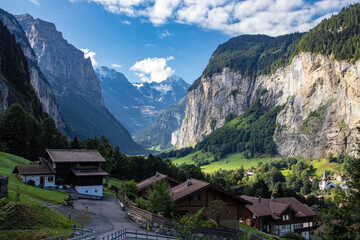 Fototapeta na wymiar View of Lauterbrunnen Swiss town with Staubbach waterfall on its side. This village is one of the most touristic places in Switzerland