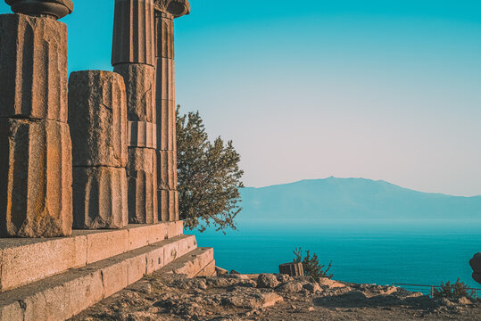 Temple of Athena. Assos Ancient City ruins with the Aegean Sea and the Lesbos Island in the background.