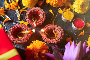 Indian Festival diwali concept. Gift box and oil lamp on festival background.