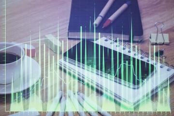 Double exposure of forex chart drawing and cell phone background. Concept of financial trading